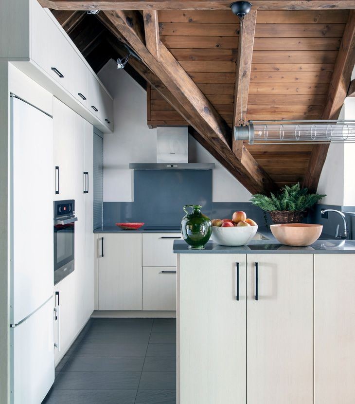 Small kitchen with wooden ceiling and white and gray furniture