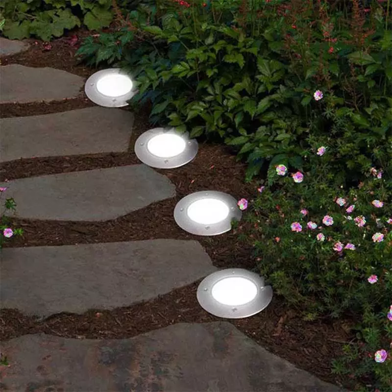 lights installed on the ground to illuminate garden pathways
